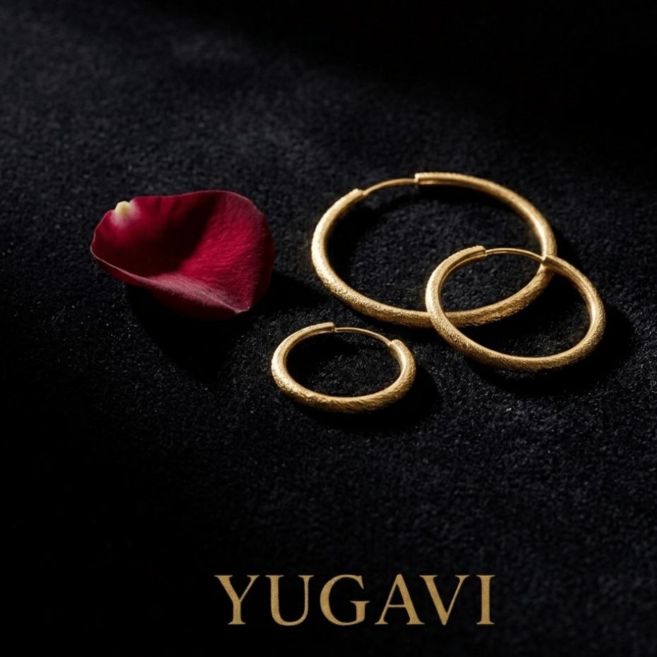 Gold hoop earrings on black velvet — Yugavi jewellery