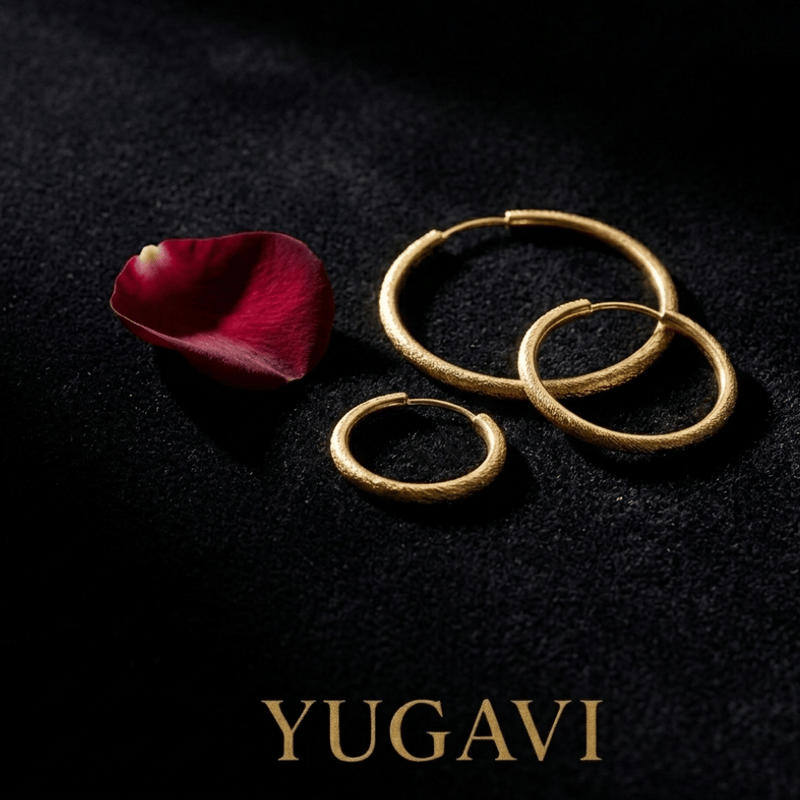 Gold hoop earrings on black velvet — Yugavi jewellery