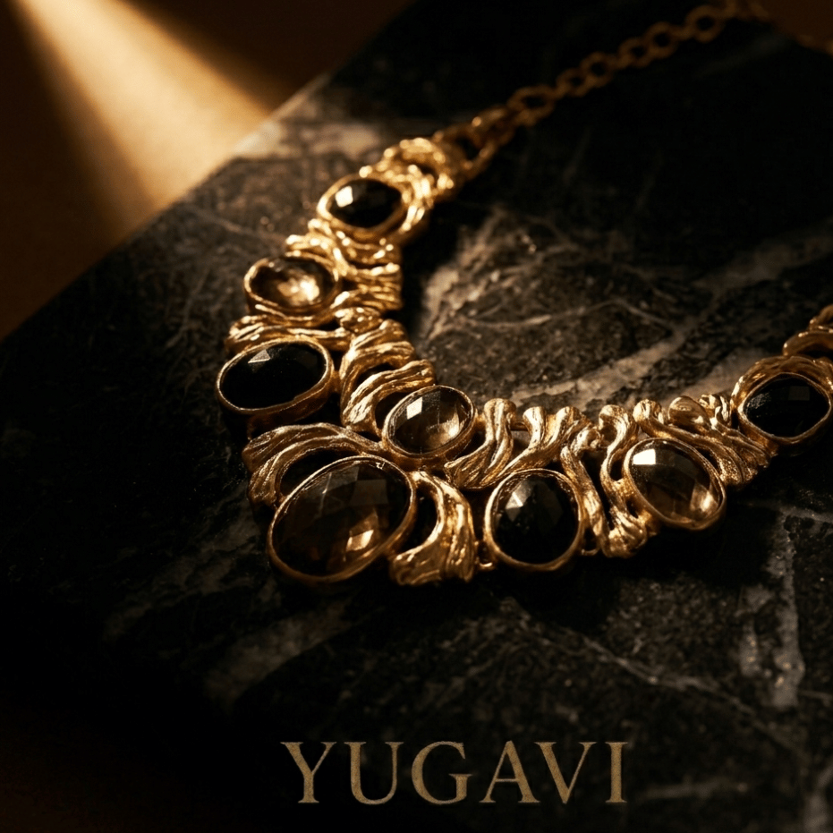 Bold gold statement necklace lit against black — Yugavi After Dark Atelier