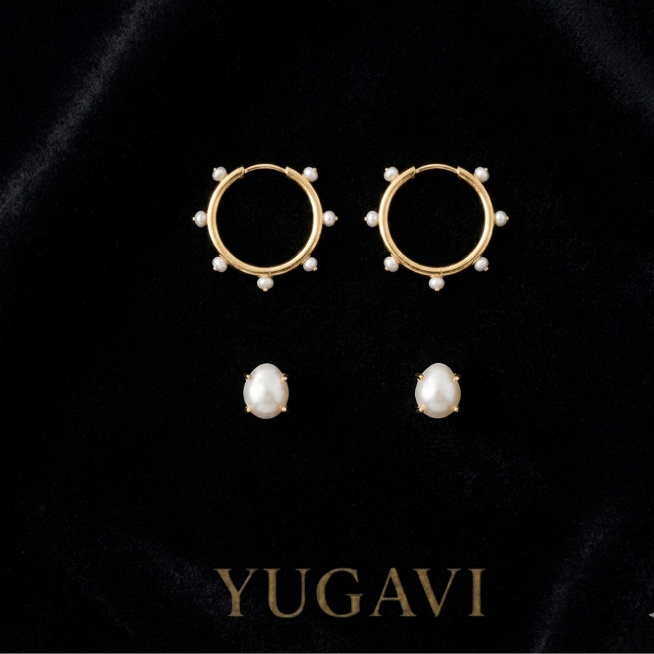 Curated gold earring pairs on black velvet — Yugavi earrings collection