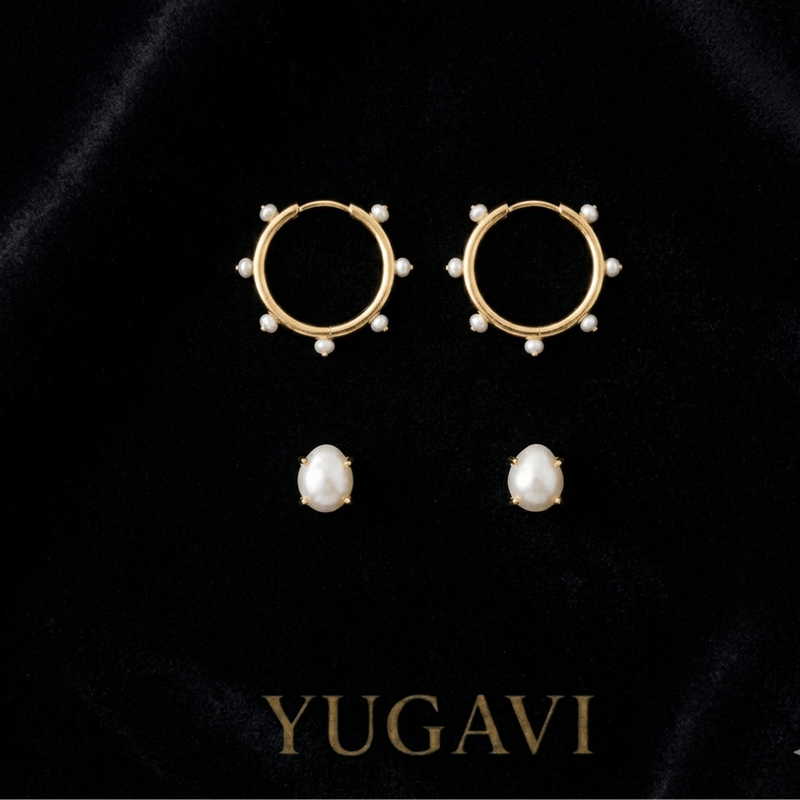 Curated gold earring pairs on black velvet — Yugavi earrings collection