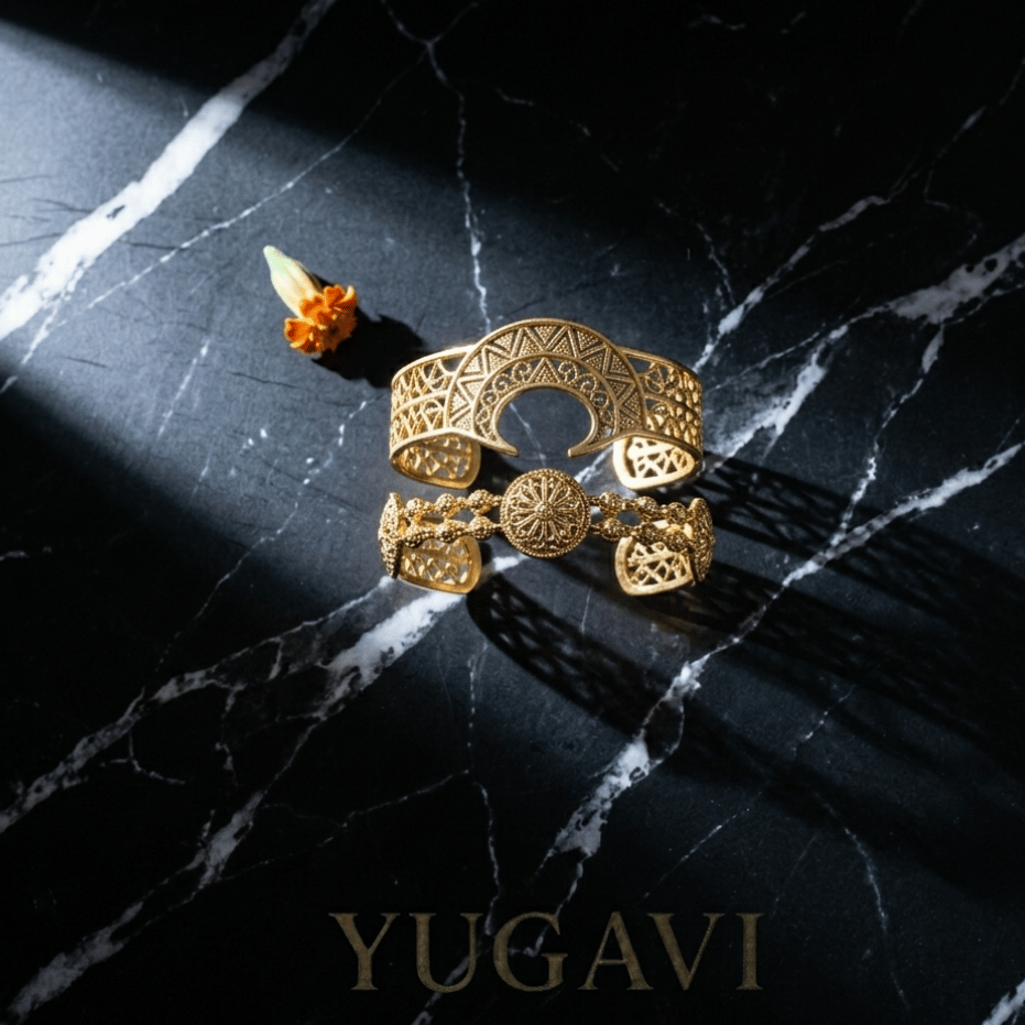 Gold bangles on black marble — Yugavi bracelets collection