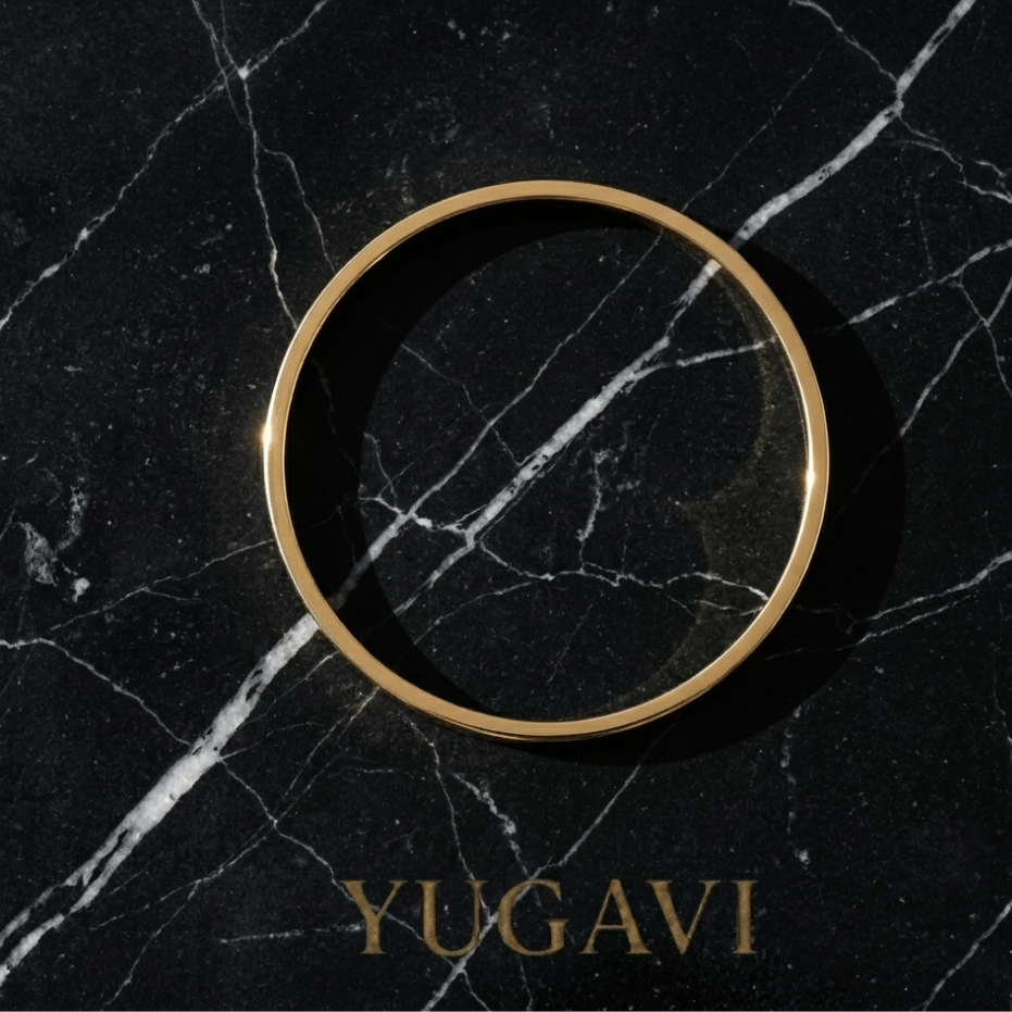 Slim gold bangle on black marble — Yugavi The Refined Hour collection