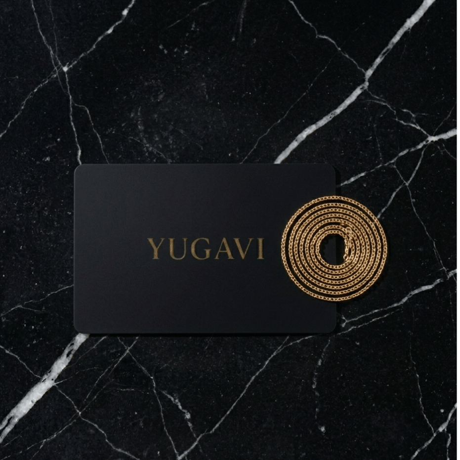 Yugavi matte black gift card with gold chain on marble