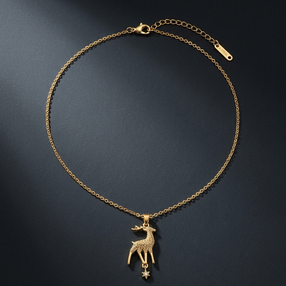A delicate gold chain necklace featuring a small deer pendant with a dangling star charm, displayed on a dark textured background.