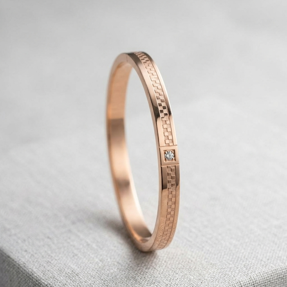 A rose gold eternity band ring with a small clear gemstone, resting on a textured gray fabric surface.