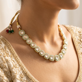 Close-up of Maṇipaṭṭa Indigo continuous kundan polki choker — graduating rectangular stones in deep royal blue enamel frames on adjustable gold dori — heritage jewellery by House of Yugavi