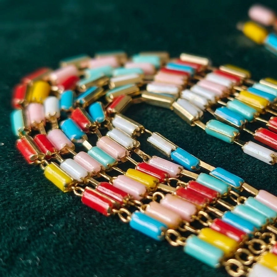 Colorful beaded bracelet on a dark green background