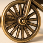 Close-up of a bronze-colored wheel with spokes on a beige background