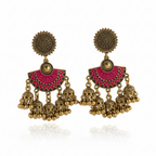 Detail of Yugavi Devanshi triple jhumka cascade — three antique gold engraved dome jhumka bells with bead drops hanging at graduated heights from the magenta enamel arch base, showing the cascading bell arrangement