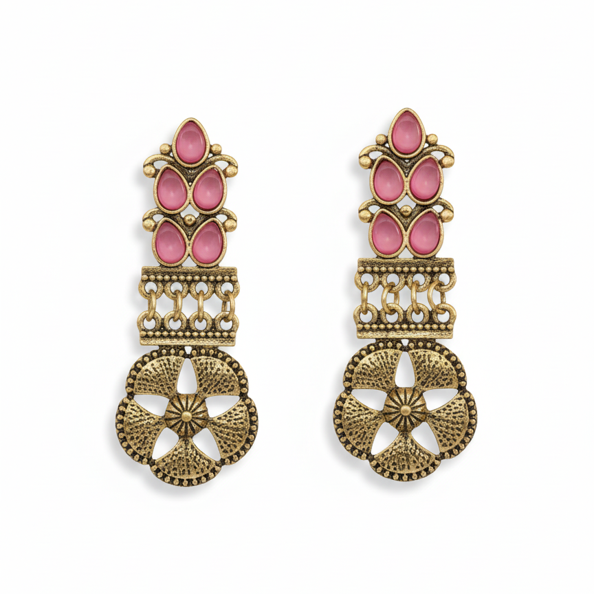 Detail of Yugavi Navira open flower disc — large circular antique gold disc with four rounded petal-shaped cutouts creating an open four-petal flower, heavily hammered and textured metal surface, bead-dot outer border and radiating starburst centre engraving