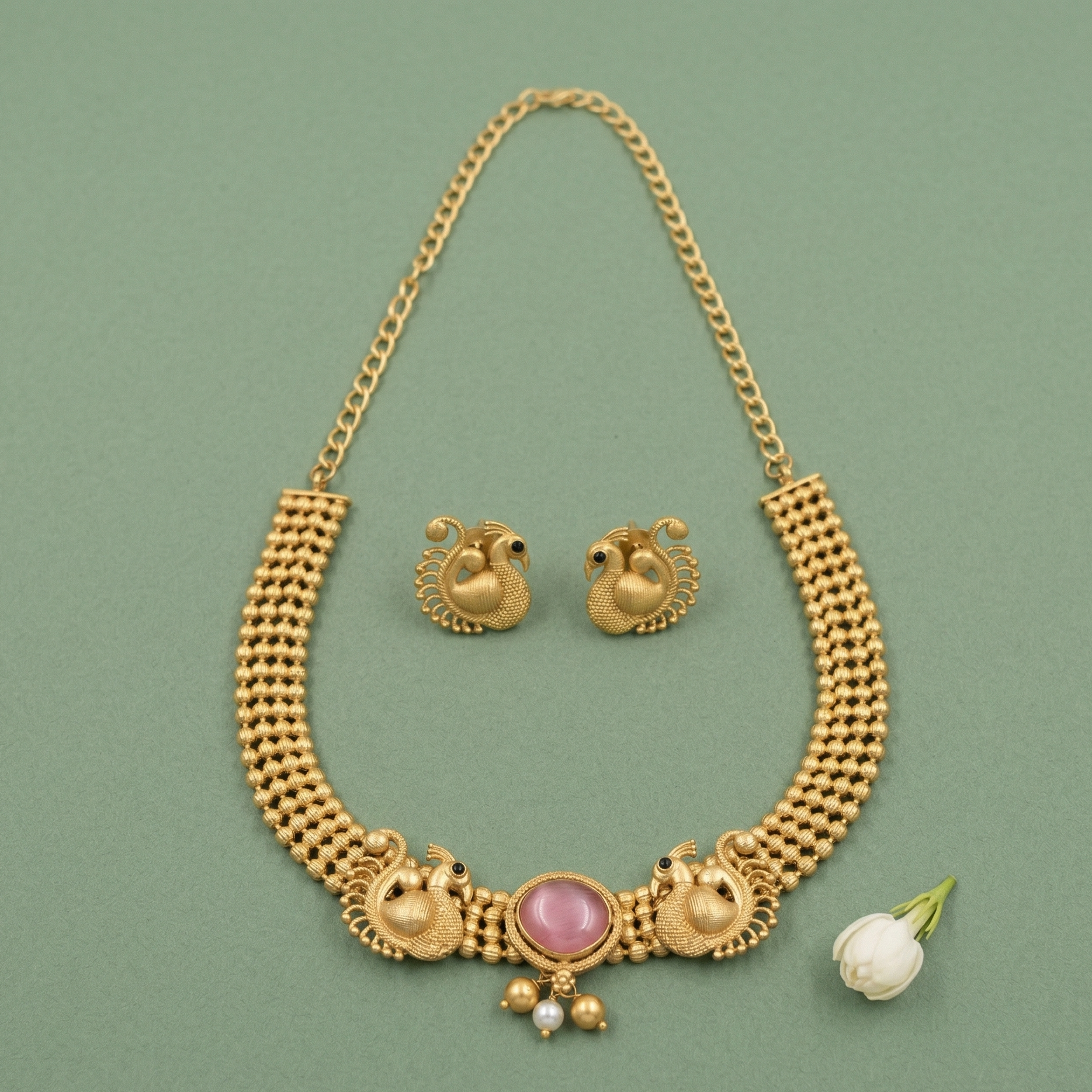 Full view of Yugavi Mayura antique gold temple jewellery set showing lobster clasp chain extender, wide latticed four-row choker body, peacock trio centrepiece and matching stud earrings