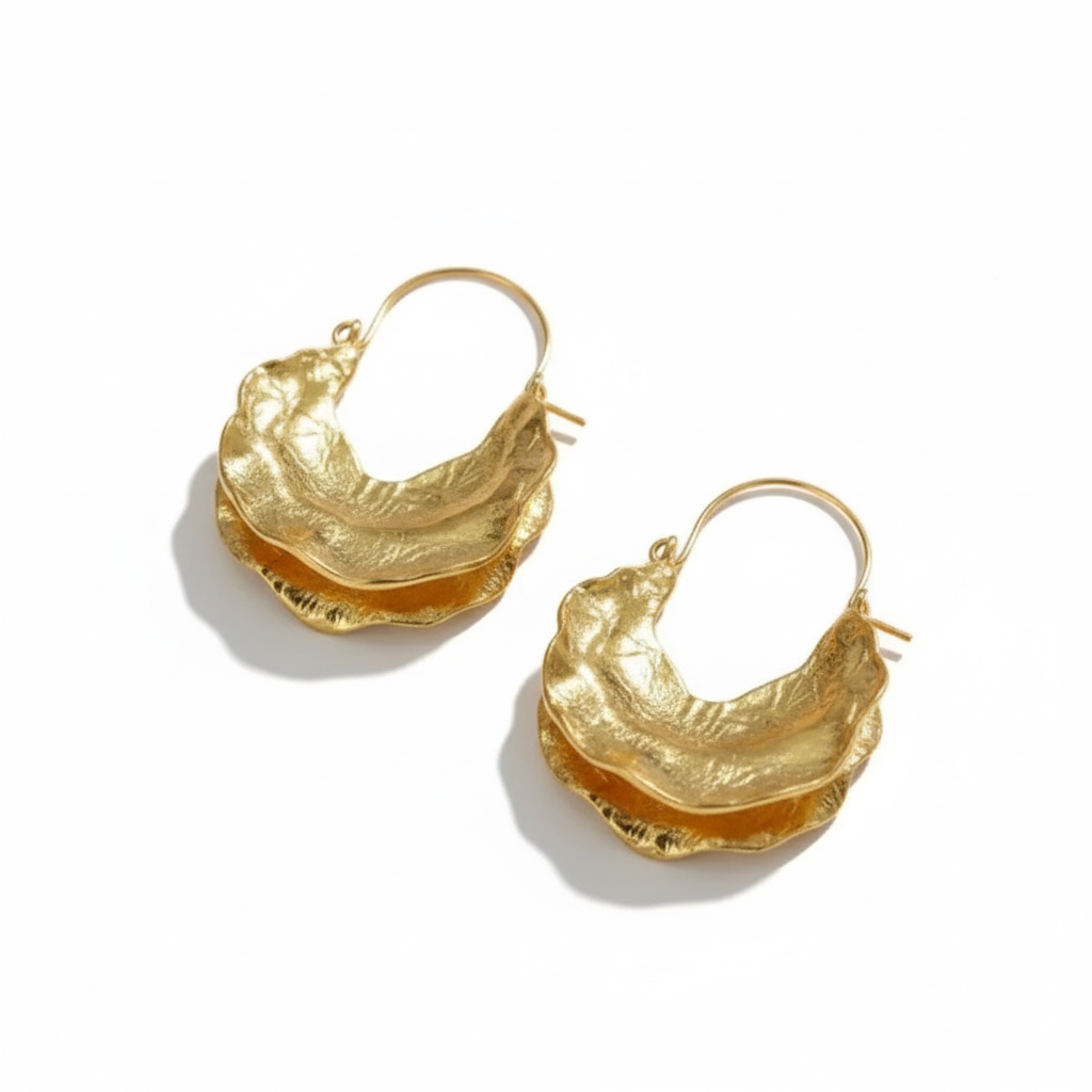 Pair of gold hoop earrings on a white background