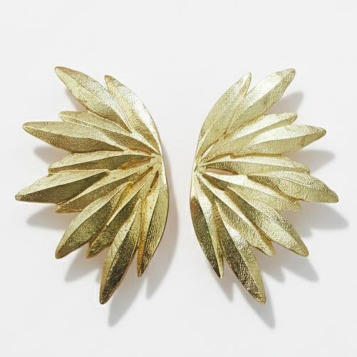 Gold leaf earrings on a white background with 'YUGAVI' branding.