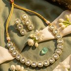 House of Yugavi Maṇipaṭṭa Indigo kundan polki necklace set — royal blue meenakari framed polki stones in graduated row, gold dori with bead connectors and matching cluster earrings, festive jewellery India