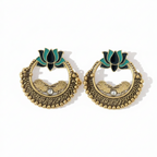 Interior detail of Yugavi Sadira earring — two engraved gold leaf or wing forms symmetrically placed inside the open circle, flanking a single white kundan stone at centre, with open negative space above and below showing light passing through