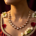 Khaṇḍakī graduated kite shield kundan polki necklace with ruby red meenakari enamel borders on gold dori and matching 4-stone shield cluster stud earrings by House of Yugavi Kansyam