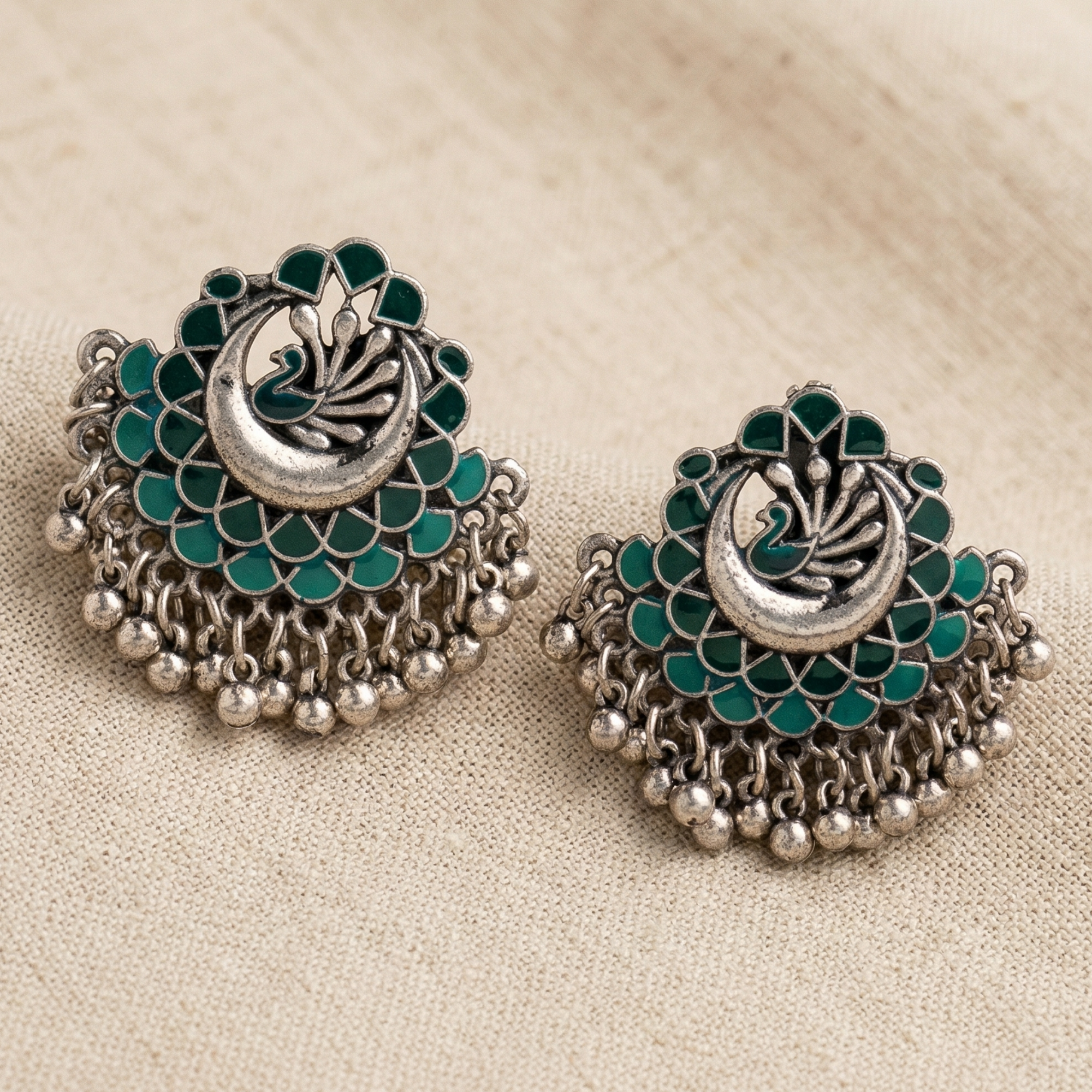 Oxidized silver chandbali earrings with peacock design and bead drops
