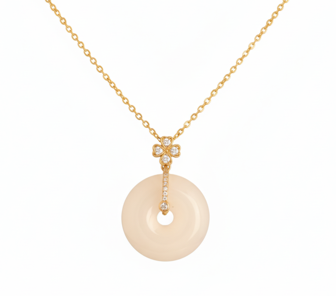 Yugavi Aarna Necklace flat lay — ivory disc pendant necklace in gold with zirconia accents — Sacred Circle Collection — Yugavi Jewels