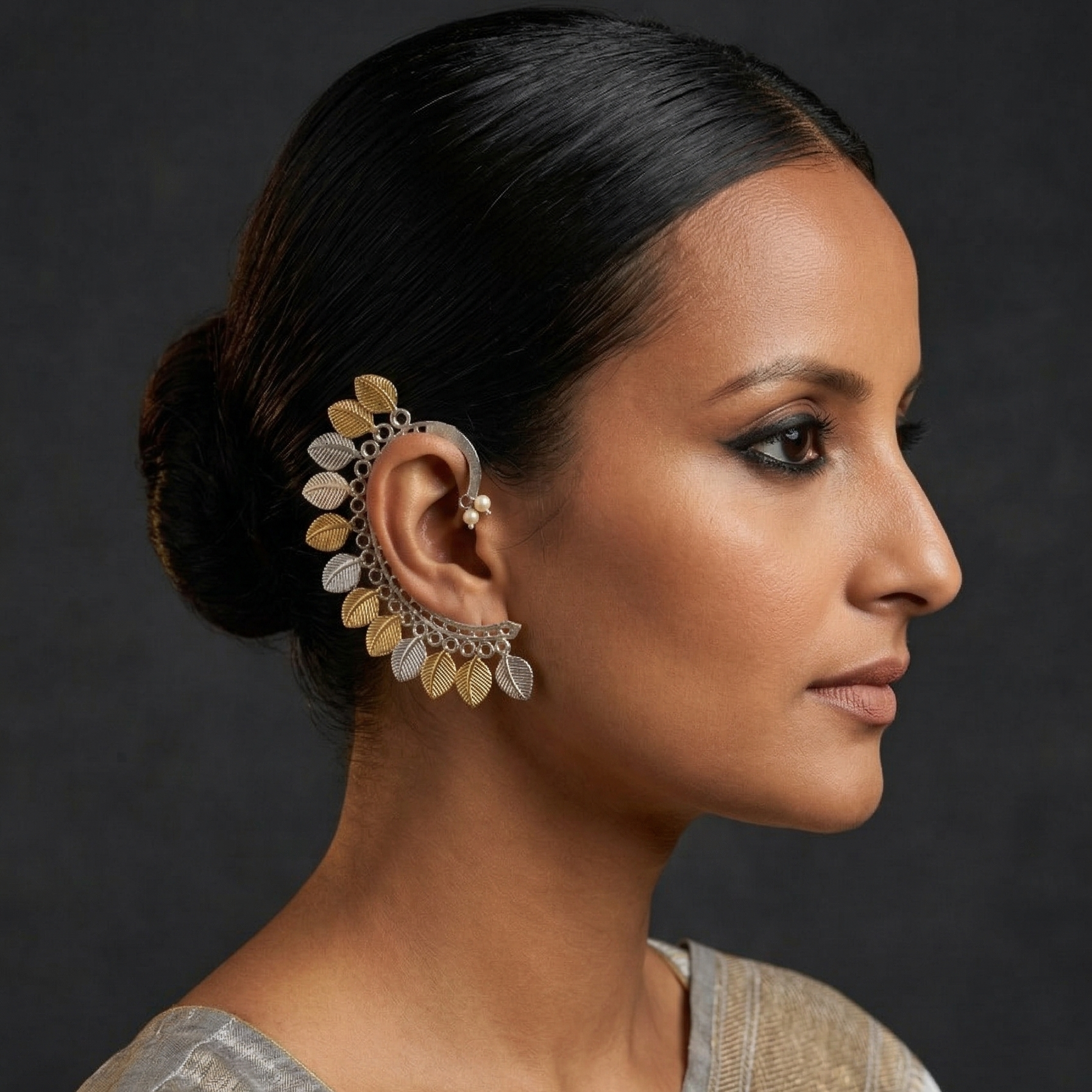 Yugavi Dvitīya brass rhodium gold ear sweep pair mirrored view — full ear crawler silhouette showing complete arc sweep from lobe to upper ear, alternating silver and gold engraved leaf drops — House of Yugavi