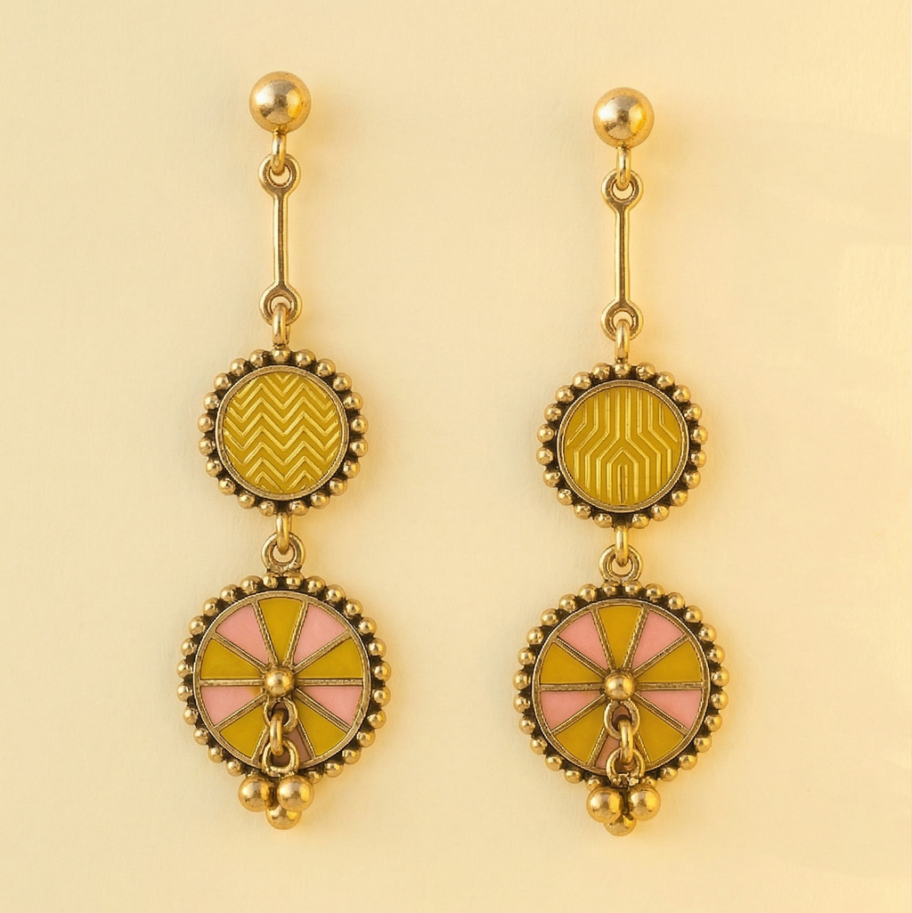 Yugavi Ishnavi double disc drop earrings displayed as a pair on off-white background — polished gold ball stud tops with bar connectors, medium circular upper discs with mustard yellow geometric enamel and gold bead borders, larger lower chakra wheel discs alternating mustard yellow and blush pink wedge enamel with central gold dome and three gold ball drops at base