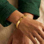 Yugavi Mangal gold sacred symbol engraved slim bangle worn on wrist — unisex spiritual gold bracelet — Yugavi Sacred Circle Collection — Yugavi Jewels