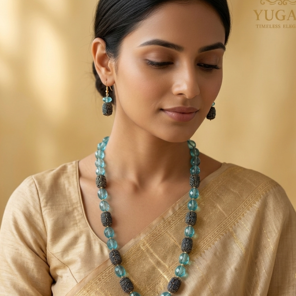 Woman wearing a necklace and earrings with a gold background, featuring the YUGAVI brand.