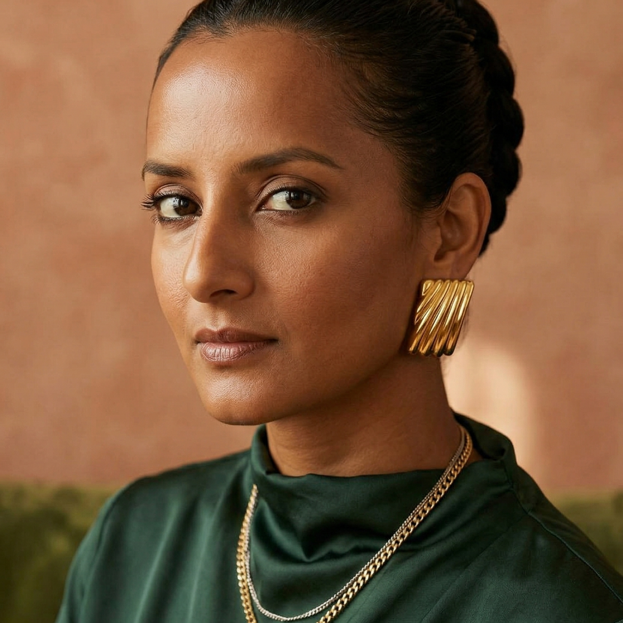 Yugavi Shankha bold gold ridged fan stud earrings worn on ear — chunky gold statement earrings — Yugavi Jewels