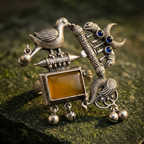 Yugavi Srishti Ring — large oxidised silver mythological statement ring with amber stone bird snake fish motif and ghungroo bells — houseofyugavi.com