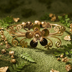 Yugavi Vana gold floral filigree open cuff bangle with scrolling vine openwork, small flower cutouts, gold bead accents and raised 3D dimensional centre flower bloom with oxidised dark petals, front view —