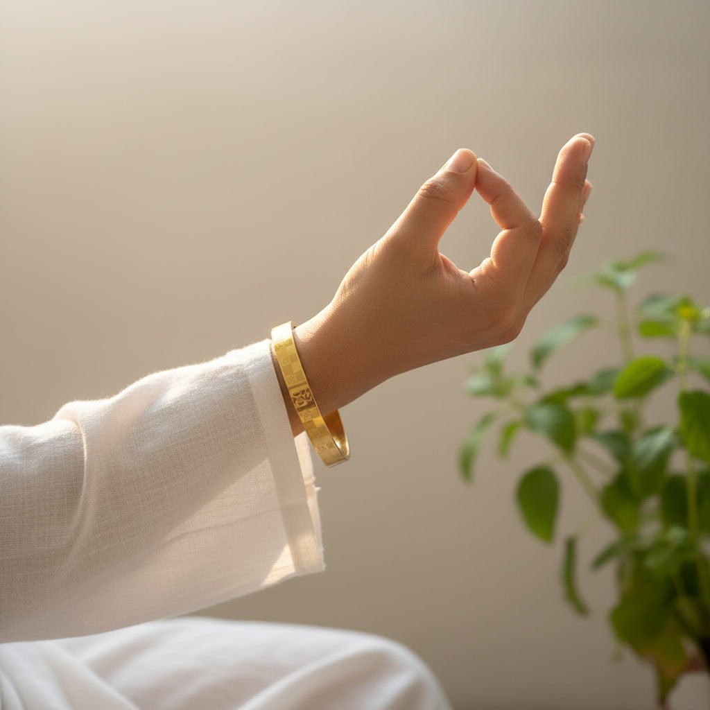 Yugavi Dev gold Om engraved bangle worn on wrist — unisex gold kada — Yugavi Sacred Circle Collection — Yugavi Jewels