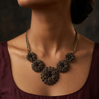 antique gold five flower black crystal pave statement bib necklace graduating V shape chrysanthemum floral heavy curb chain lobster clasp adjustable extender bold dramatic party cocktail date night festive wedding reception gifting fashion jewellery Yugavi buy online India