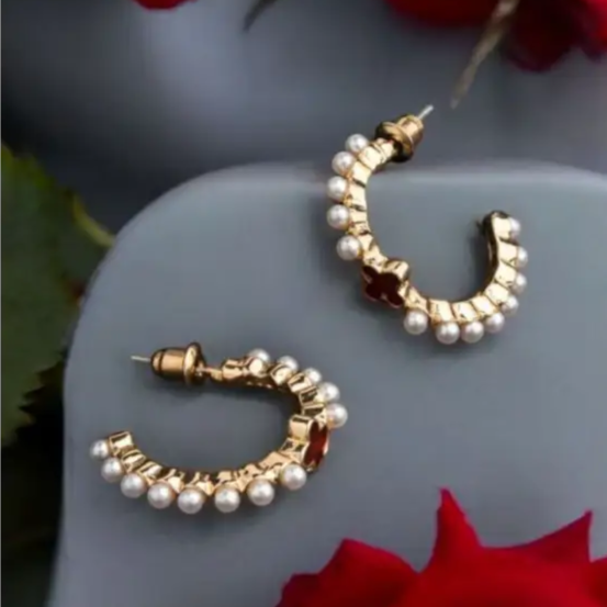 Yugavi Ishira gold seed pearl hoop earrings flat lay — medium C-hoop pair with hammered textured gold band and individual seed pearls along the full outer arc, push-back stud closure, displayed on clean white or ivory background