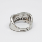 rhodium cocktail statement ring with raised architectural crown, princess cut CZ centre channel and round pavé CZ flanking rows, side angle view